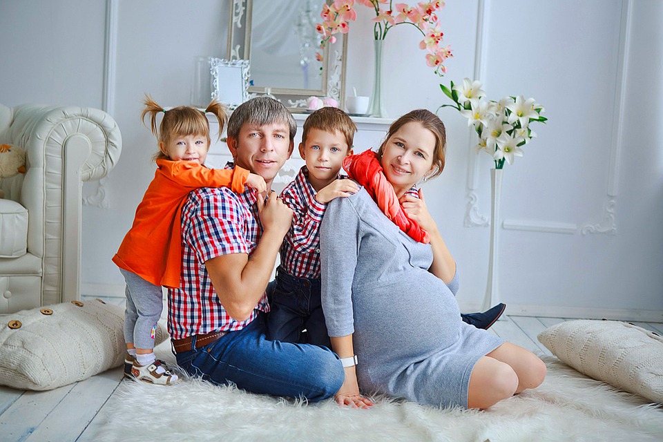 image of a family sitting on a couch